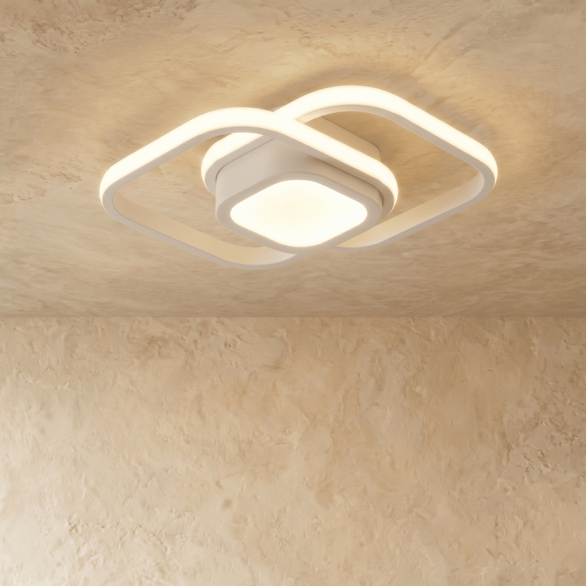 Clérachic white ceiling light with two overlapping rounded-square acrylic loops and a glowing square centre, on plaster.