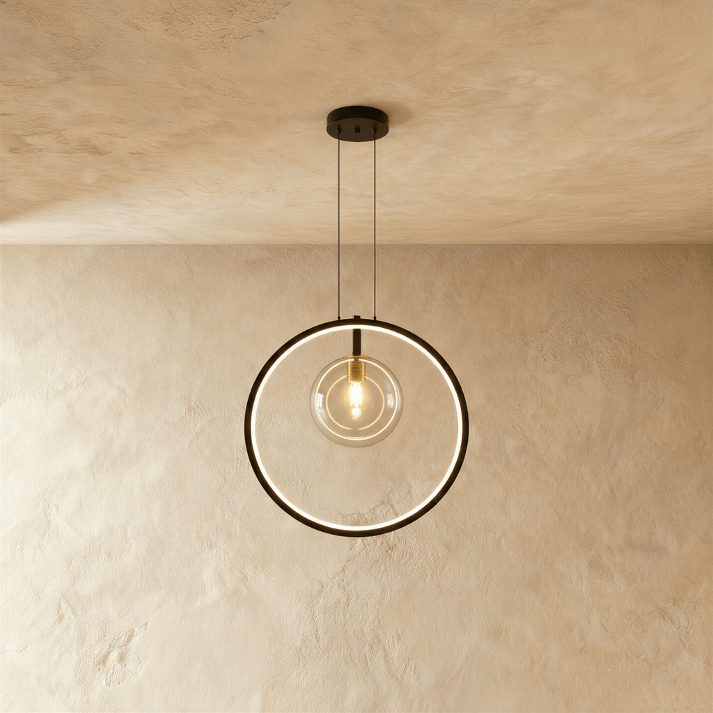 A single Clérachic ring pendant frames one exposed brass-fitted bulb in a slim black circle, hung on thin cables.