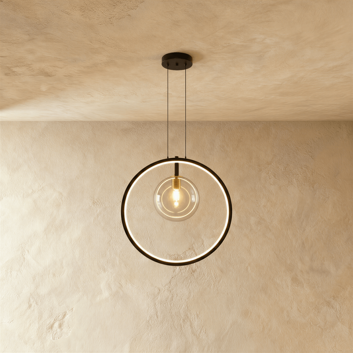 A single Clérachic ring pendant frames one exposed brass-fitted bulb in a slim black circle, hung on thin cables.