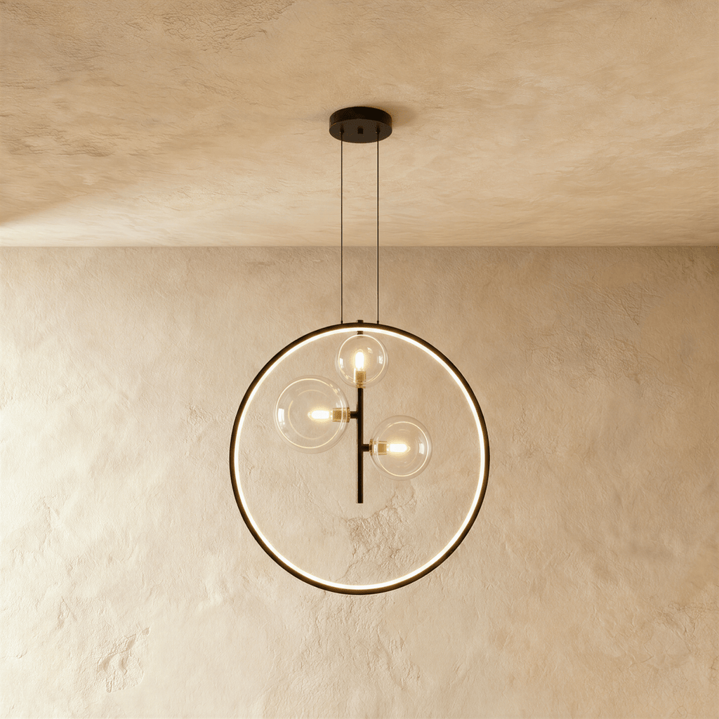A Clérachic ring pendant stacks three glass globe bulbs vertically on a black rod inside its illuminated circle.