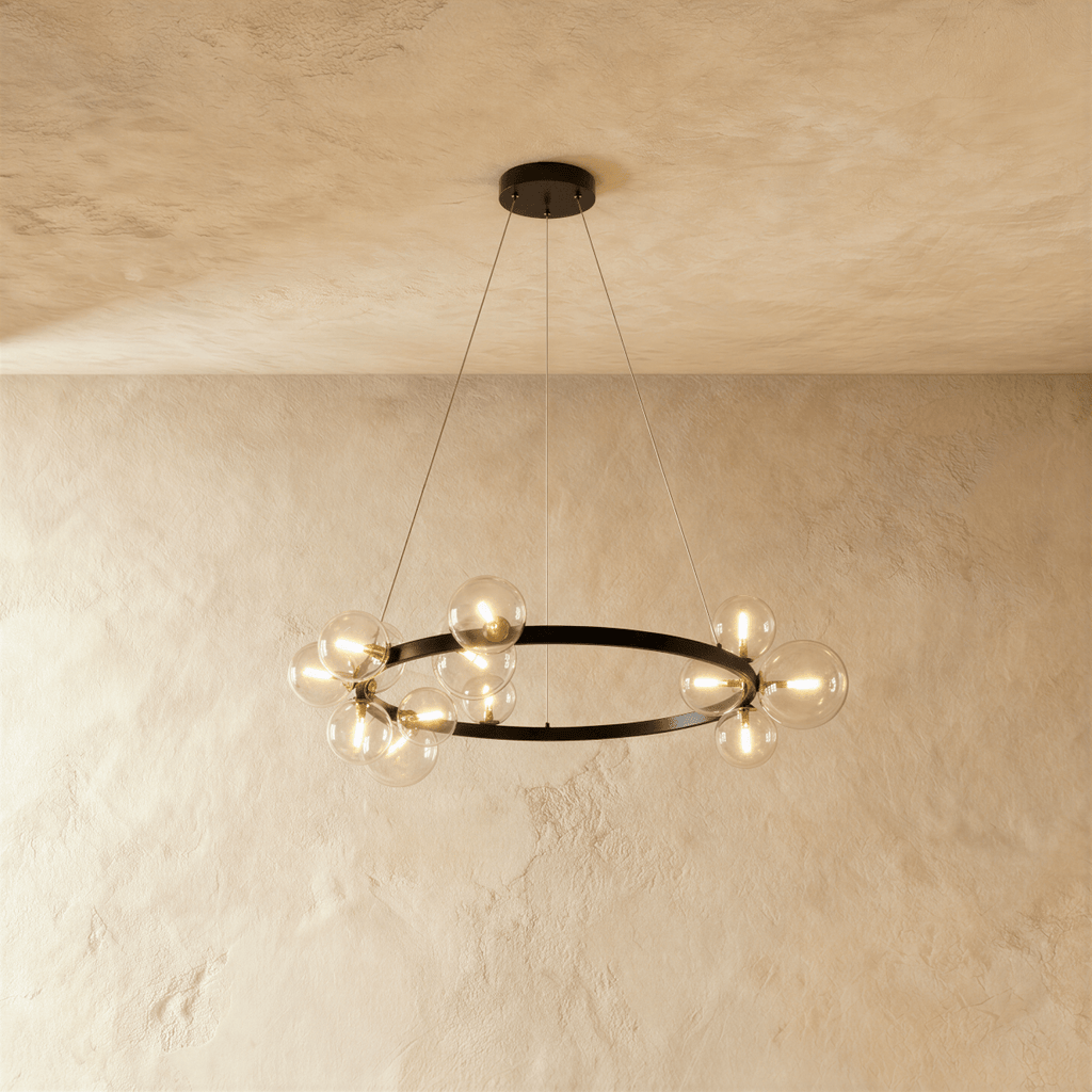This large Clérachic ring chandelier rings clear glass globe bulbs around its full black circumference on two cables.