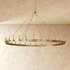 Clérachic largest brass ring chandelier, its candle-style bulbs spaced evenly around a broad flat band on plaster.