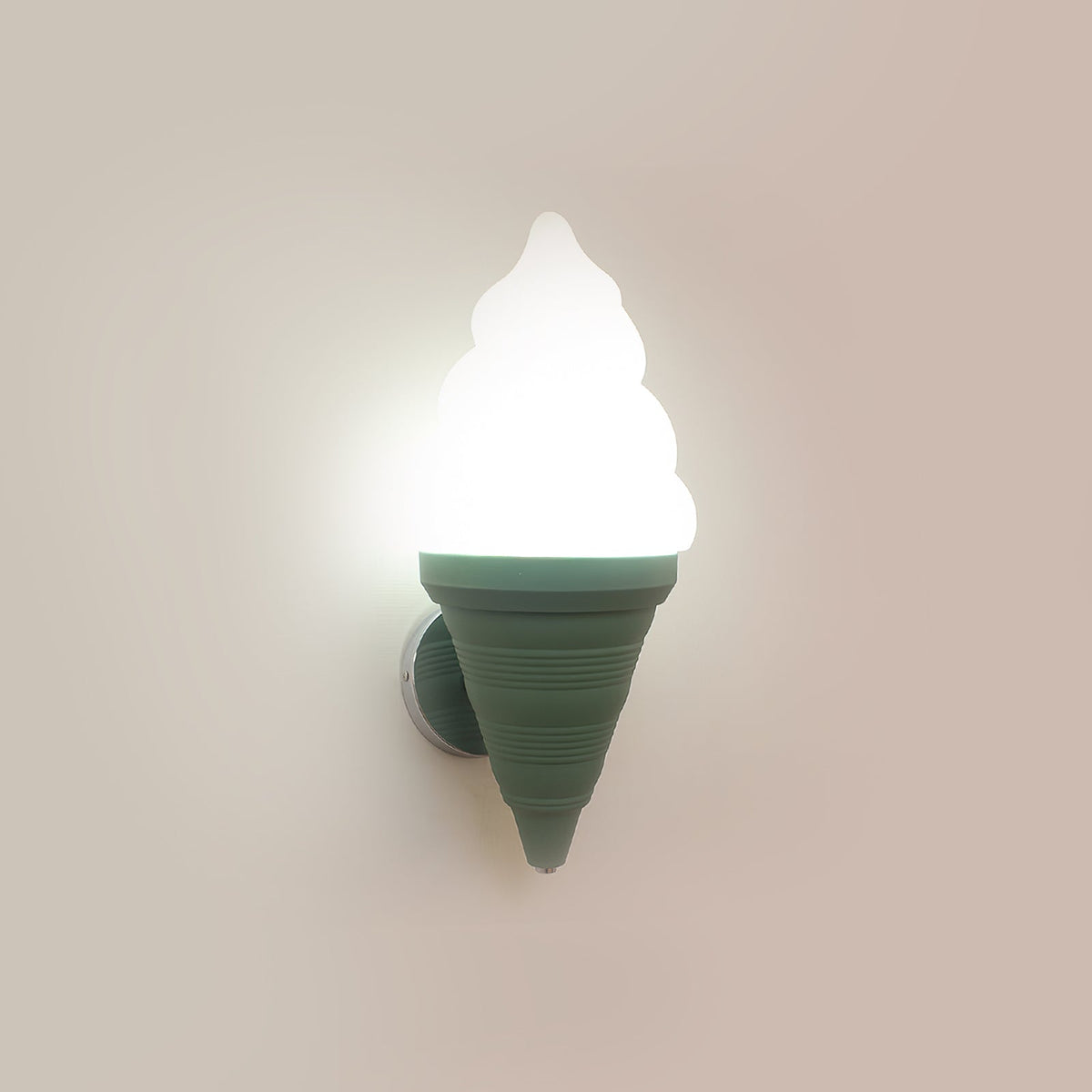 Green-coned Clérachic wall light lit in cool white on a beige wall, the swirled shade glowing bright above the ribbed cone.