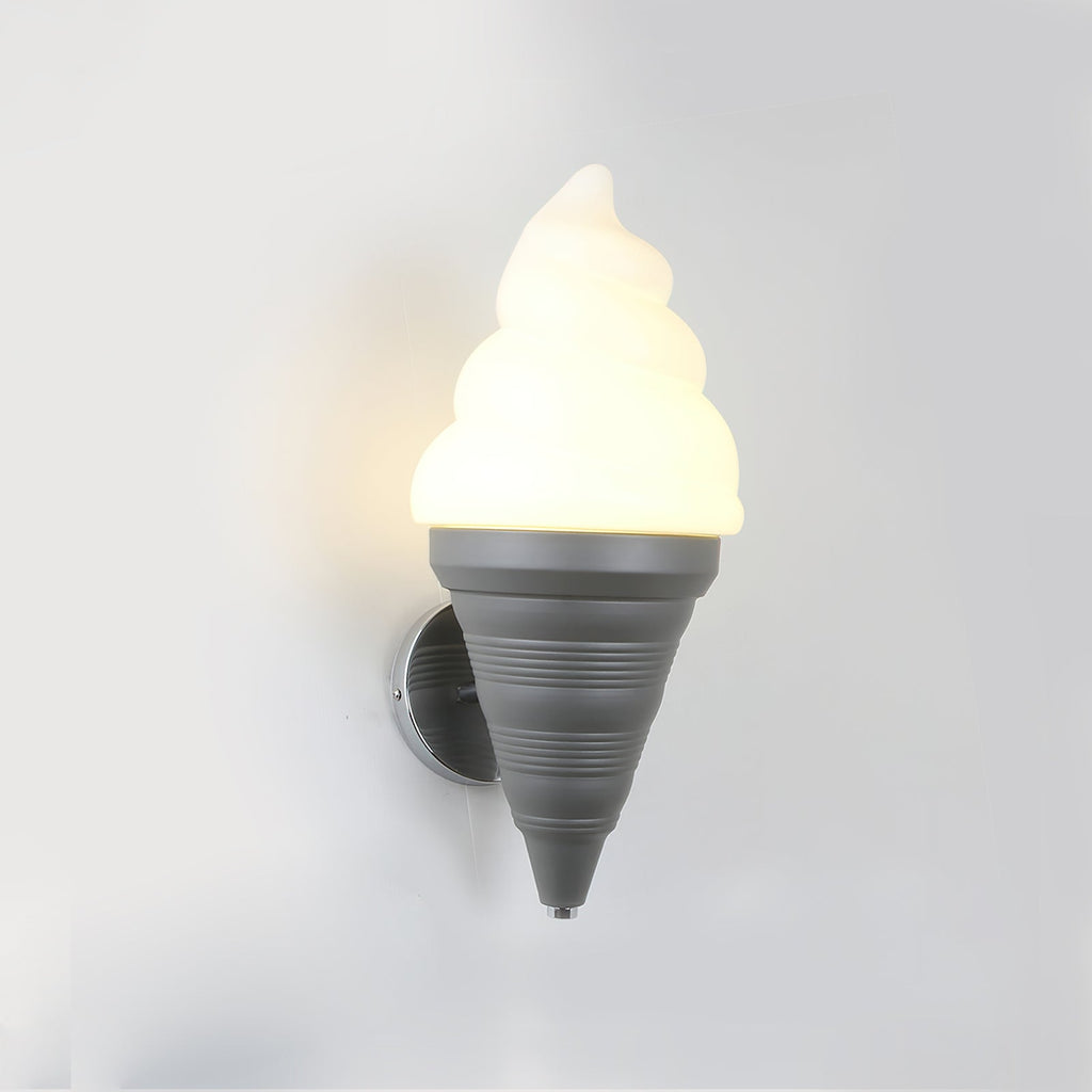 Grey-coned Clérachic wall light lit in a warm tone on a pale wall, the swirl shade glowing yellow-white above the cone.