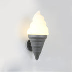 Grey-coned Clérachic wall light lit in a warm tone on a pale wall, the swirl shade glowing yellow-white above the cone.