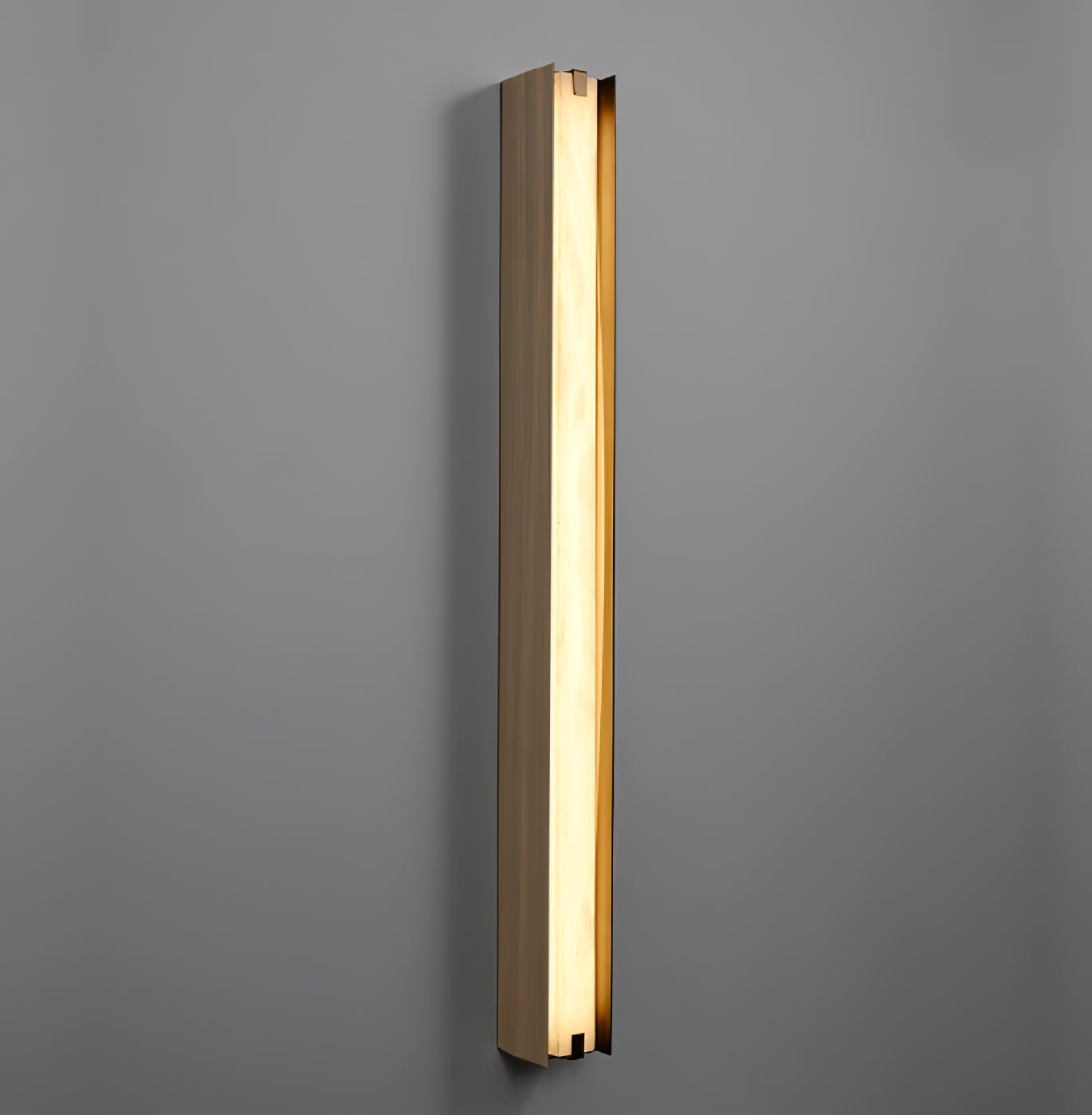 Clérachic Isolde lit on a deep grey wall, the alabaster face glowing evenly from cap to cap.