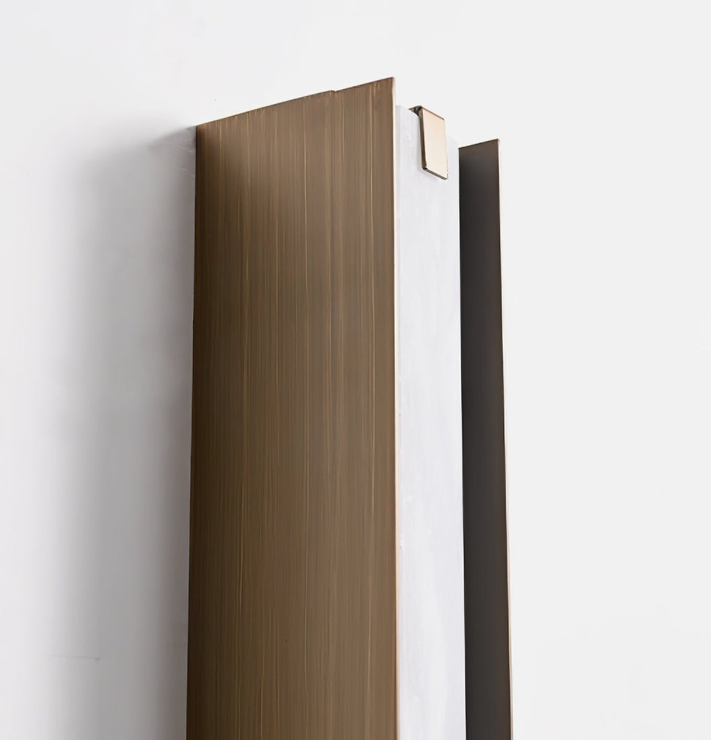 Clérachic Isolde seen from behind at an angle, revealing the brushed bronze housing and mounting channel.