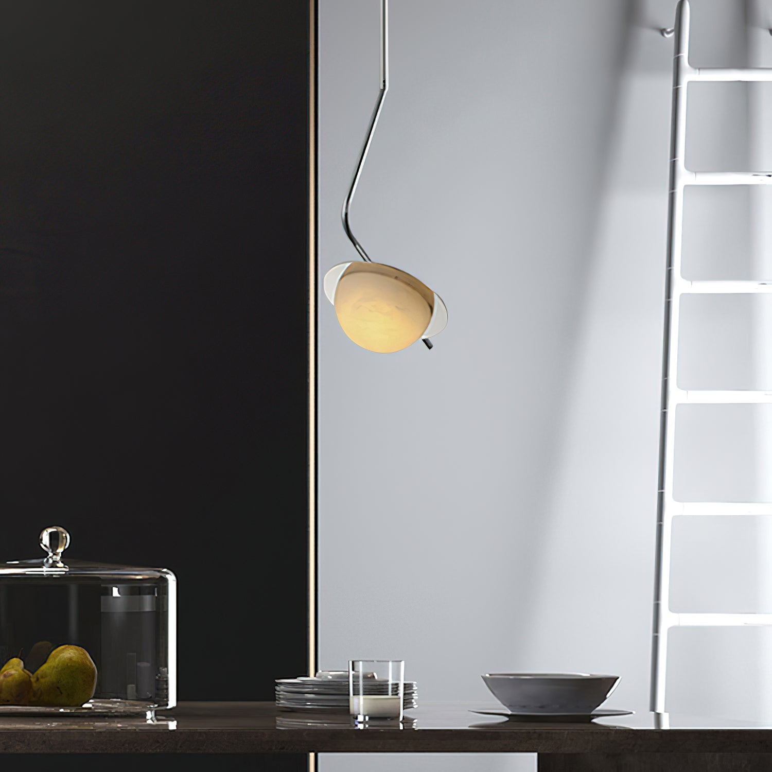 The Clérachic Ivvaros pendant over a kitchen counter, chrome stem curving out from a slim drop cable.