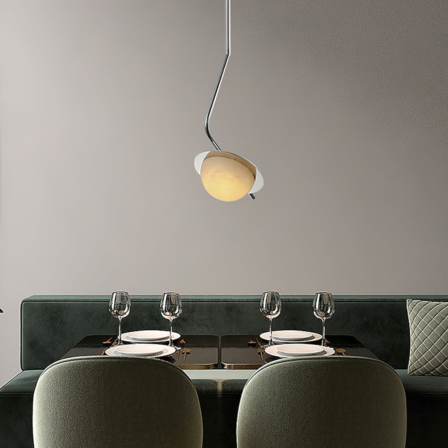 The Clérachic Ivvaros pendant centred over a laid dining table, throwing soft light onto the glassware.
