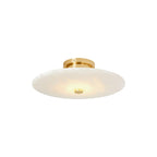 Clérachic flush mount photographed small against white, the brass canopy sitting tight to the ceiling line.
