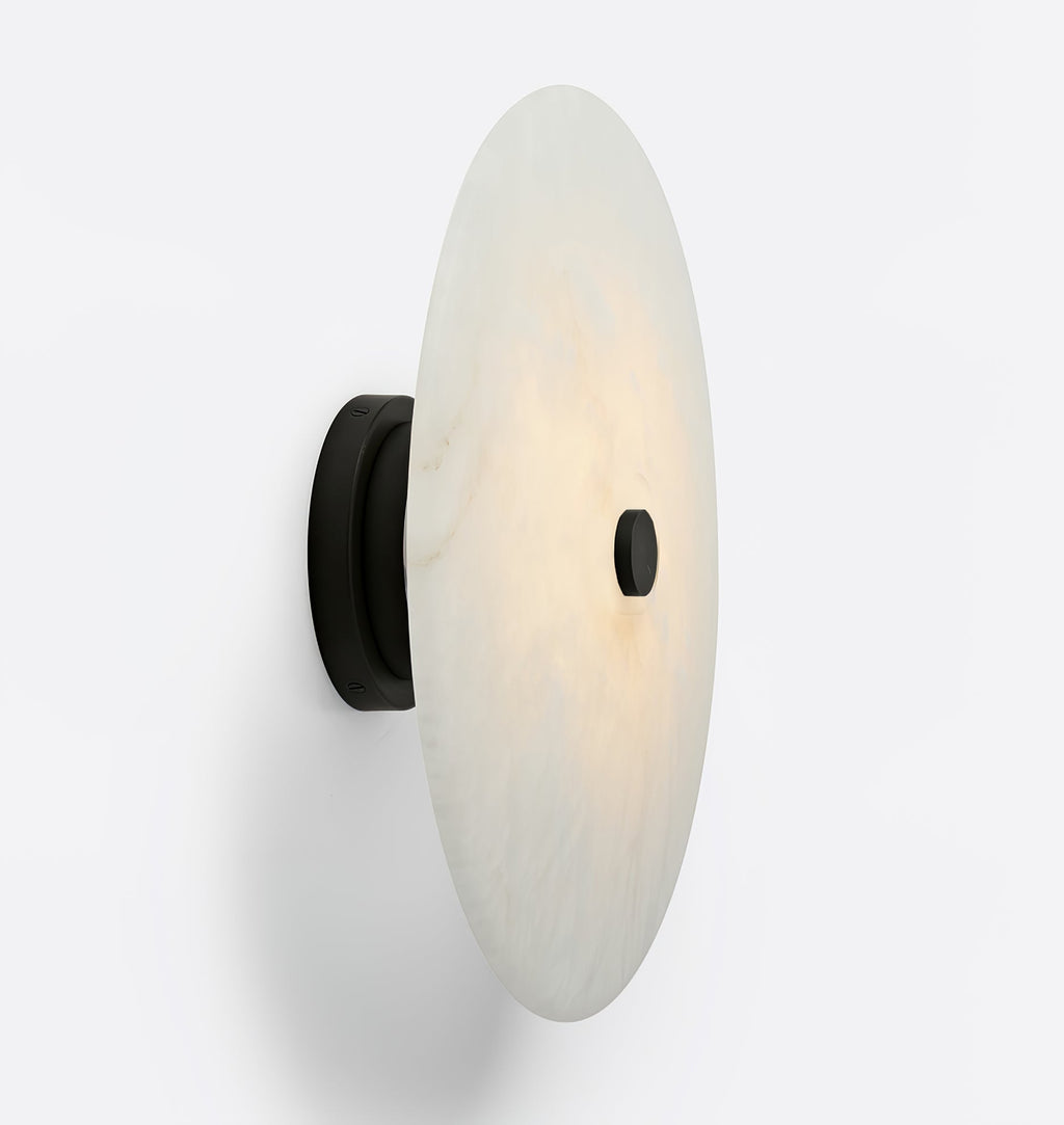 Clérachic alabaster disc shown in profile on its black mount, a slim shade held barely off the surface.