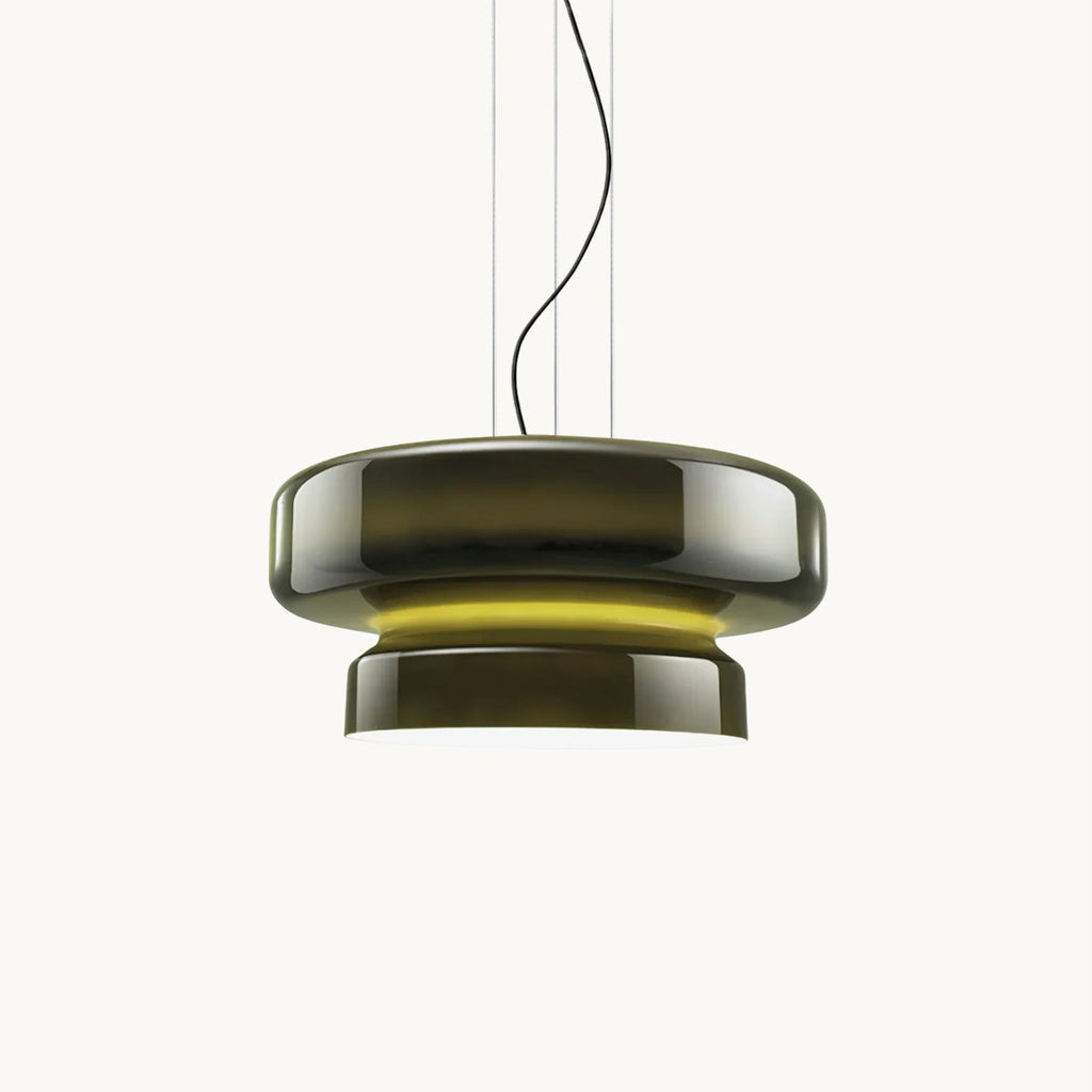 A Clérachic glass pendant in Dark Green, with a wide upper disc and a narrower lower tier, glowing yellow-green between them, on a white backdrop.