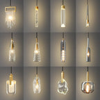 A grid of twelve Clérachic pendants in clear, ribbed, smoke grey and rock-textured glass, all lit against a grey backdrop.