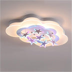 Close up of the Clérachic cloud-shaped ceiling light with hanging stars edged in lilac and blue light, mounted flush to the ceiling.
