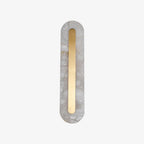 Clérachic Kristy wall lamp on white, unlit, natural stone veining across the oval.
