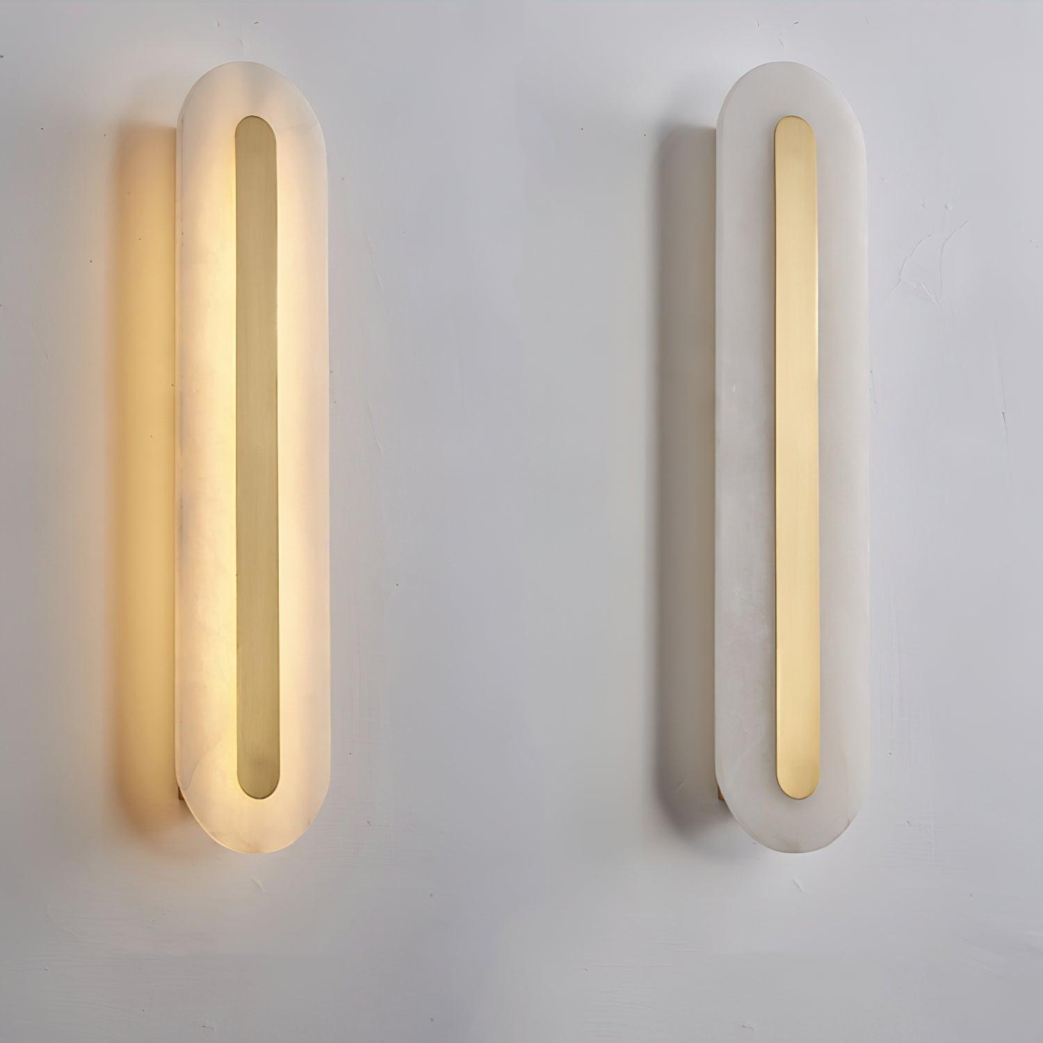 Two Clérachic Kristy wall lamps on plaster, the left lit and the right switched off.