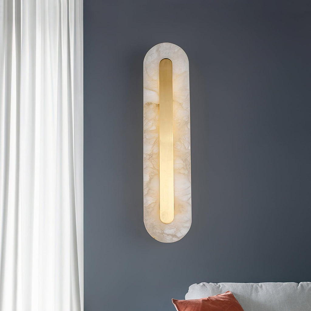 Clérachic Kristy wall lamp on a slate-blue wall beside sheer curtains and a bed.
