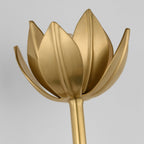 This close-up frames the Clérachic matte gold tulip head with its sculpted overlapping petals.