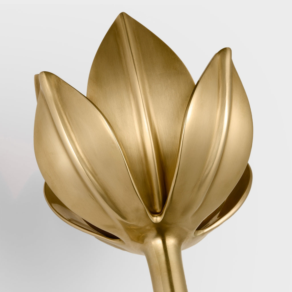 This cropped close-up shows the Clérachic matte gold tulip head and its sculpted petal texture.