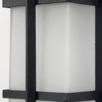 Close view of the frosted glass panel and black frame bars on this Clérachic lantern wall light.