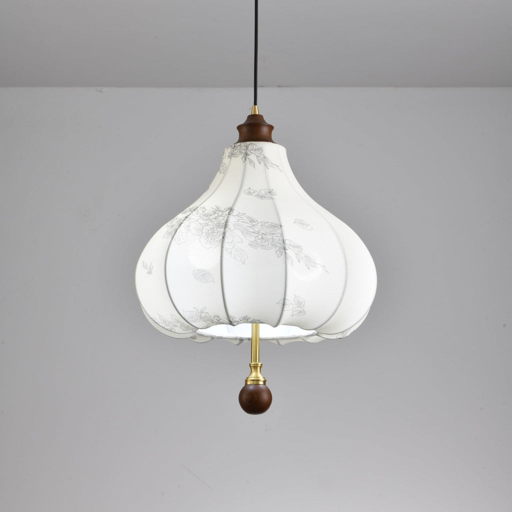 Clérachic fabric pendant light with single line-drawn leaves scattered across the panels to the right of the flower cluster.