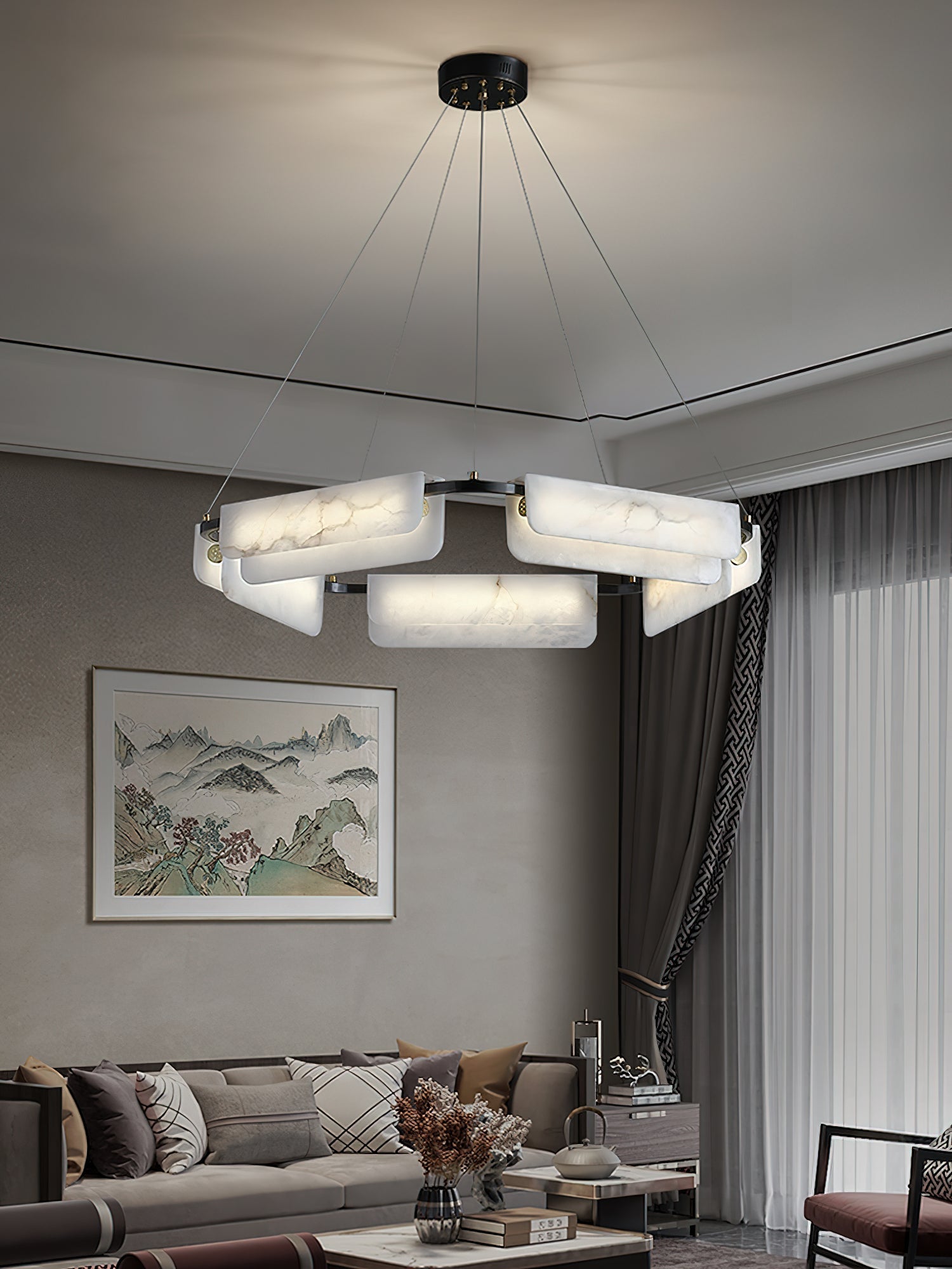 Clérachic Layered Alabaster Plate Chandelier hung from a black ceiling canopy in a lounge with a framed landscape.