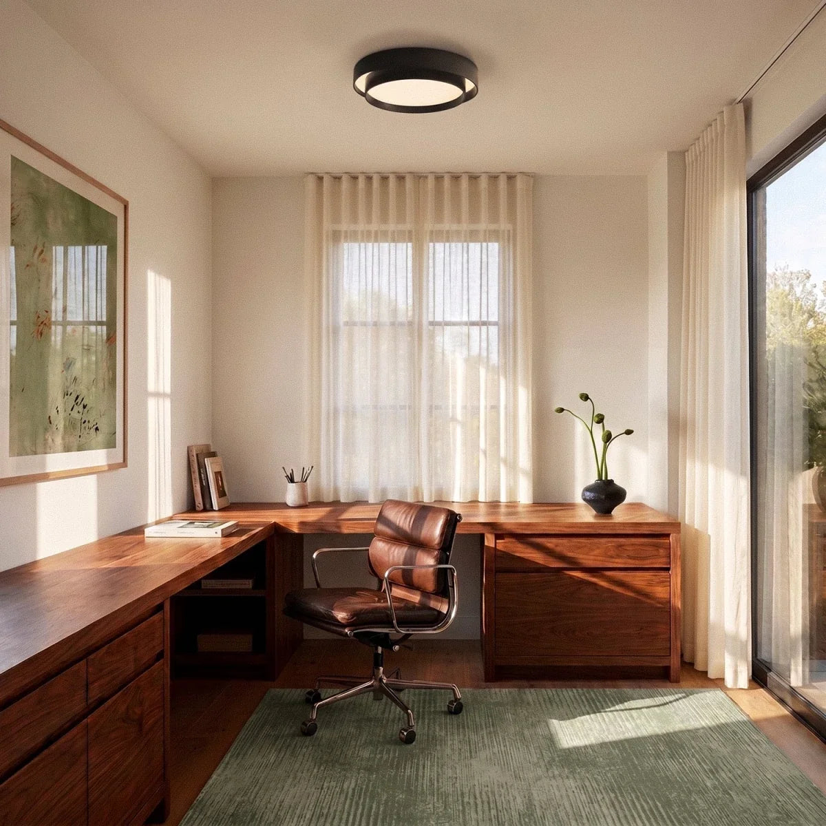 Clérachic black layered round ceiling light centred over a walnut corner desk in a sunlit home office with sheer curtains.