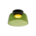 A single-layer green glass Clérachic ceiling light with a deep bowl shape, lit, on a white backdrop.