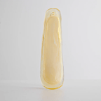 Single pale yellow glass leaf with a smooth, thick edge, shown upright on a light grey backdrop as part of this Clérachic chandelier.