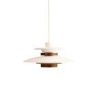 White Clérachic pendant with a dark oak band and wood cylinder, on a white cord against a white backdrop.
