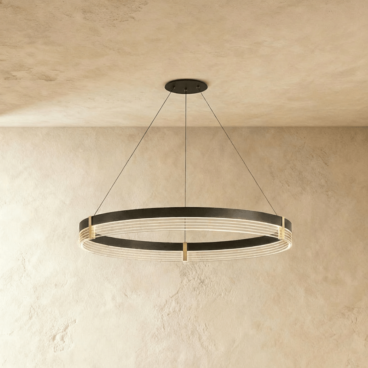 Side angle of the Clérachic single-ring chandelier shows its layered acrylic glow beneath a black metal frame.