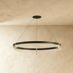 Front-on view of the Clérachic ring chandelier highlights the warm ribbed light lines within its black steel band.