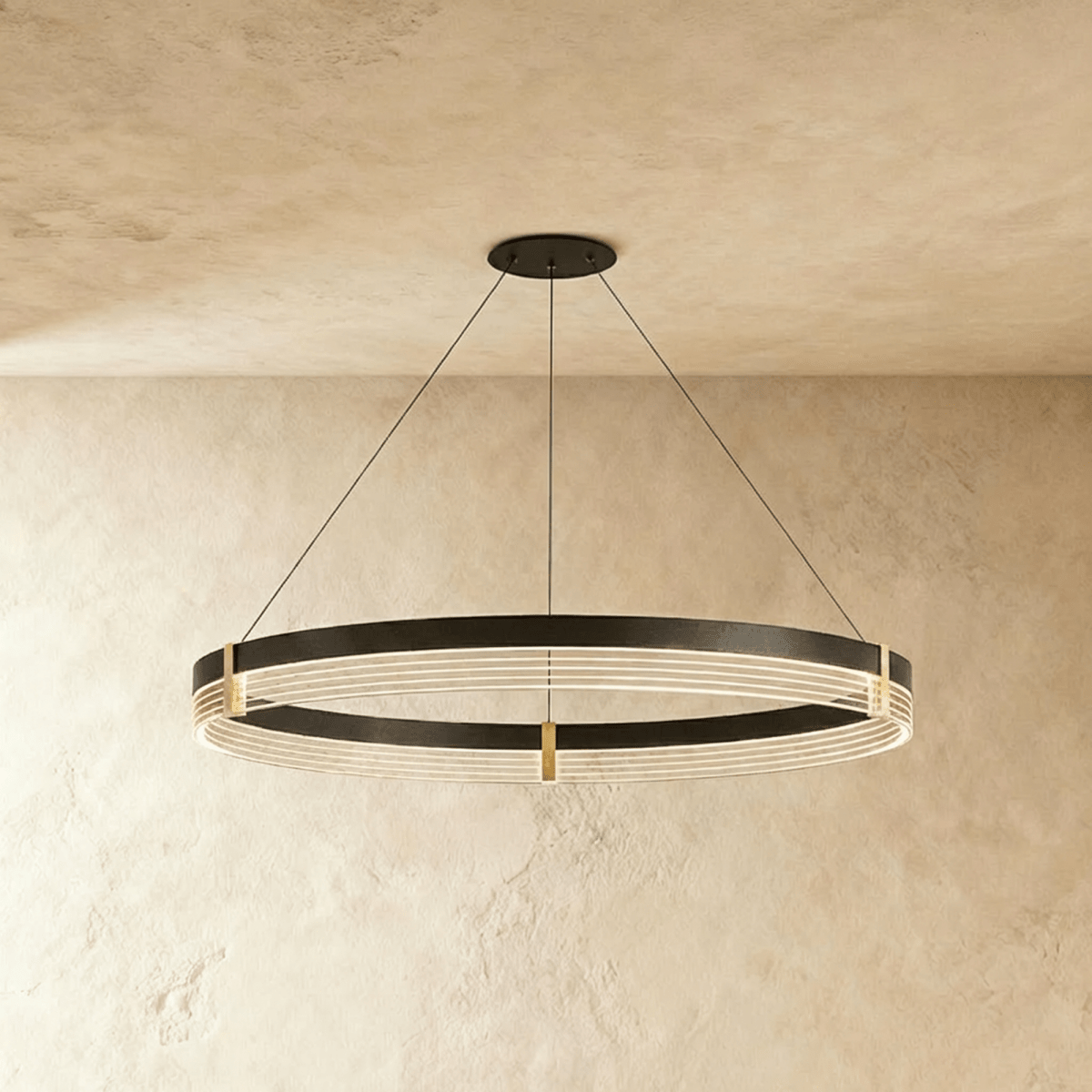 Front-on view of the Clérachic ring chandelier highlights the warm ribbed light lines within its black steel band.