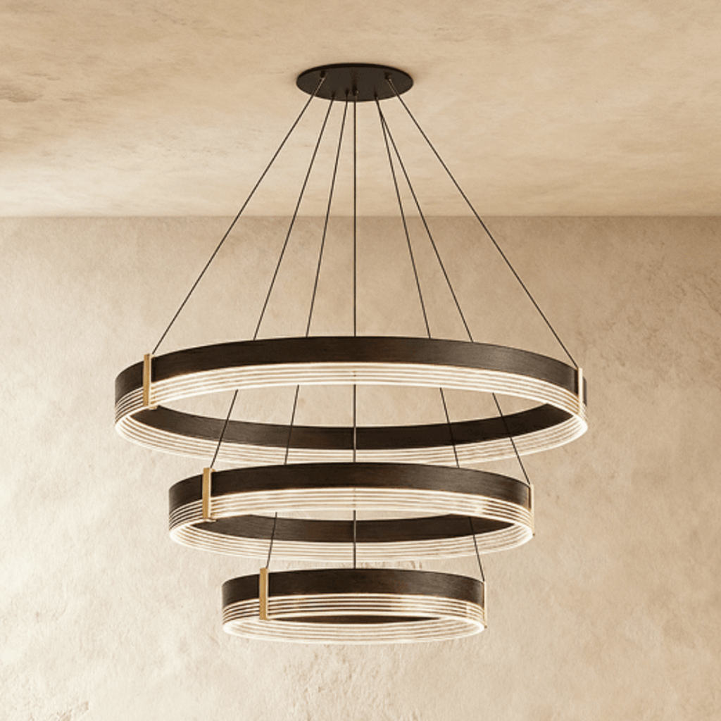 A closer angle of the Clérachic three-tier ring chandelier shows its stepped black bands suspended on fine cables.