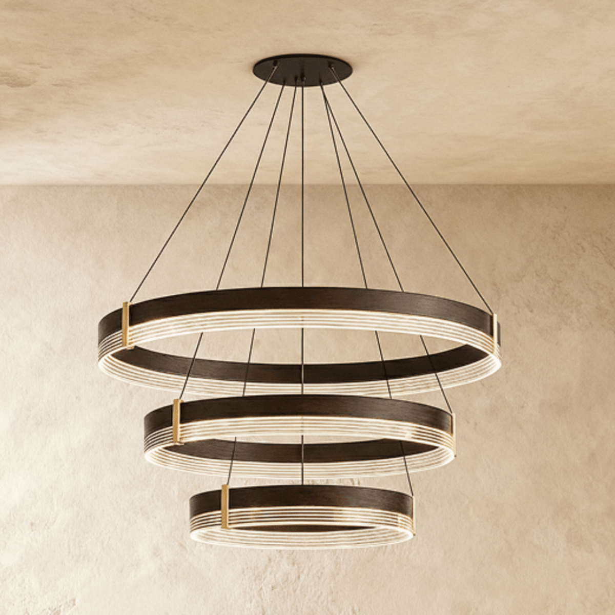 A closer angle of the Clérachic three-tier ring chandelier shows its stepped black bands suspended on fine cables.