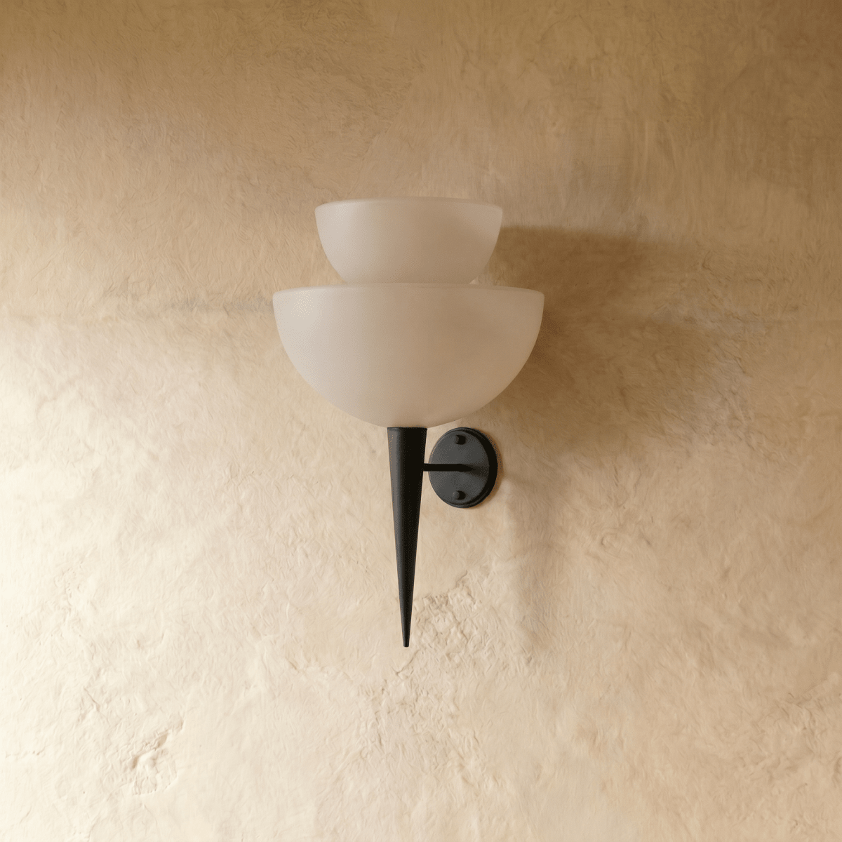 Clérachic wall lamp in matte black, close front view of the stacked frosted glass shades and tip.