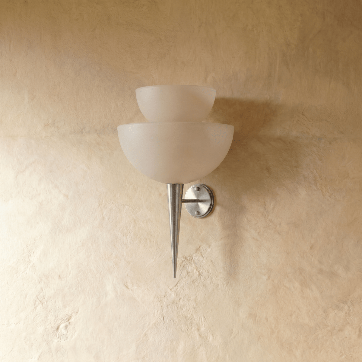 Clérachic wall lamp in chrome, front view of the stacked frosted glass shades against a plaster wall.