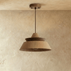 Clérachic tiered wood pendant in oak and dark walnut, unlit, hung from a slim rod and wooden ceiling plate on plaster.