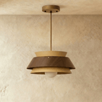 Clérachic three-tier pendant with a walnut band between honey-toned tiers, unlit, on a brass-toned rod and canopy.