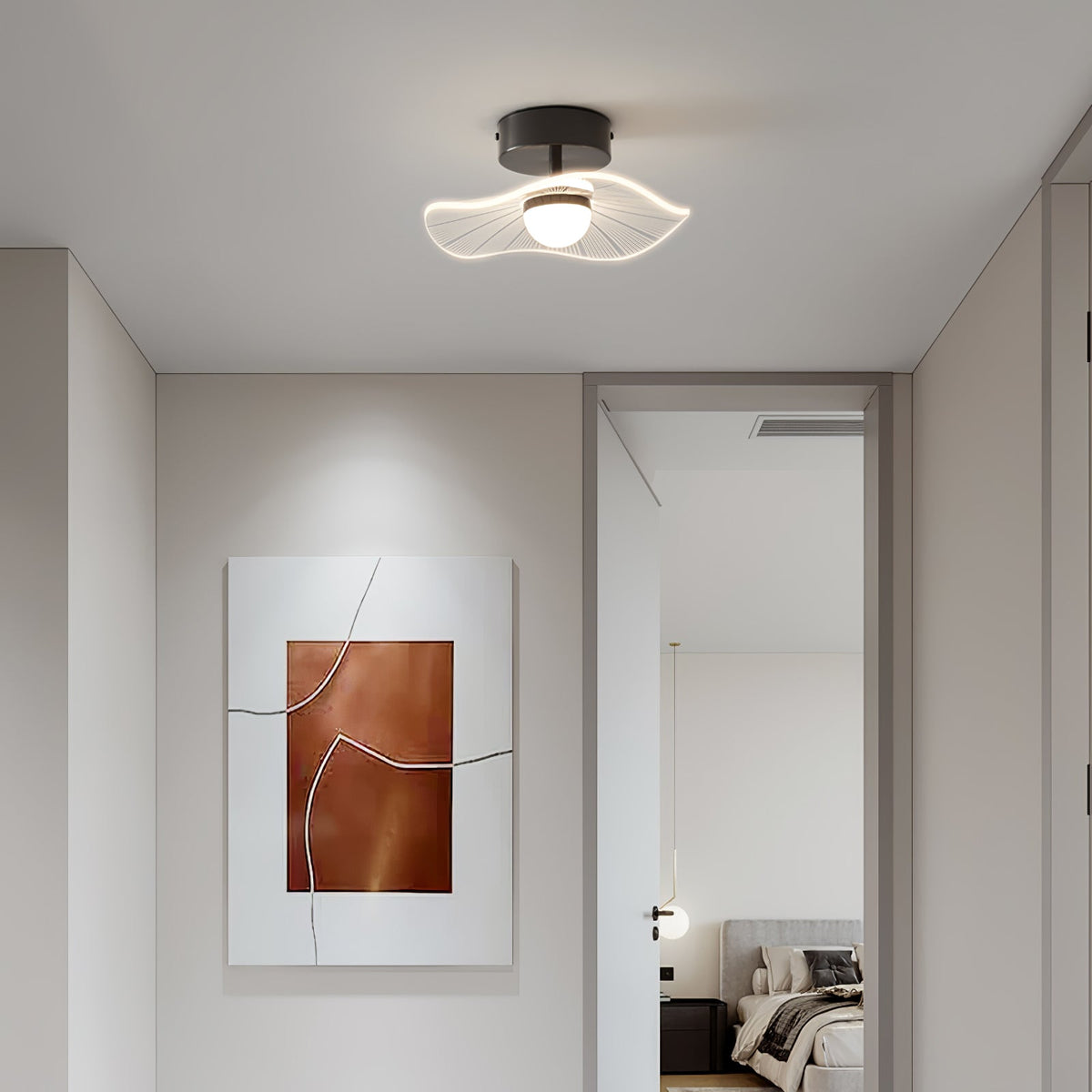 Black-fitted ceiling light with a wavy clear shade in front of a framed copper artwork and an open door, a Clérachic ceiling light.