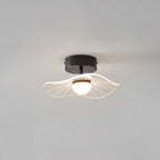 Black-fitted ceiling light with a frilly ribbed acrylic shade and a round opal bulb, on a grey ceiling, from Clérachic.