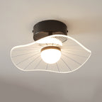 Close view of a black ceiling plate and a wavy ribbed shade lit warm around the opal globe, a Clérachic ceiling light.