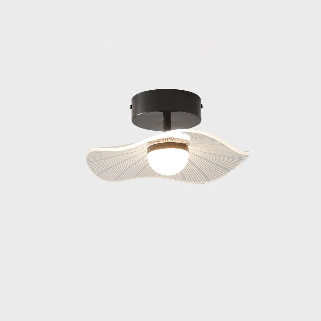 Black-fitted ceiling light with a wavy ribbed acrylic shade and opal globe, lit, on a pale grey ground, from Clérachic.