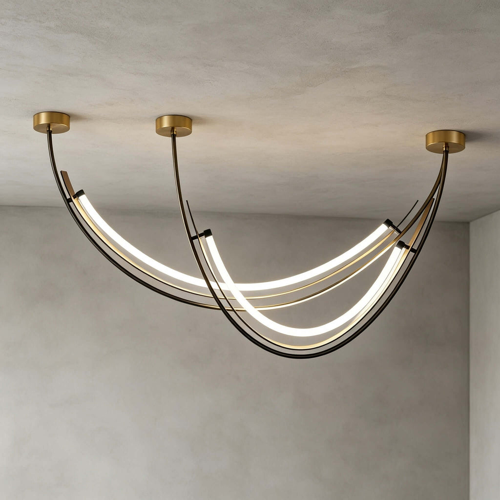Close view of the black leather-wrapped arcs and the glowing white silicone strips of this Clérachic pendant, against a grey plaster ceiling.