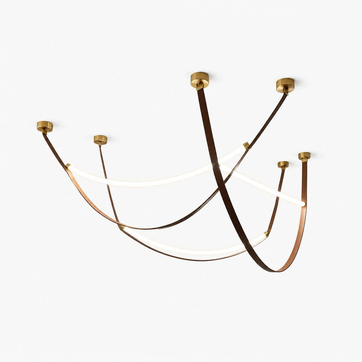 A set of three Clérachic leather-loop pendants on a white backdrop, each brown strap swooping between gold ceiling caps with a lit LED strip.