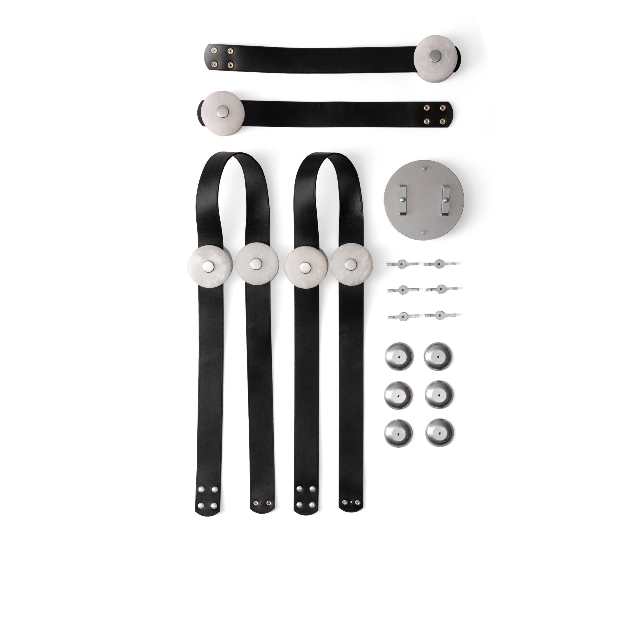 Flat lay of the Clérachic Leather Strap Chandelier parts, black straps, alabaster discs and a nickel canopy with fixings.