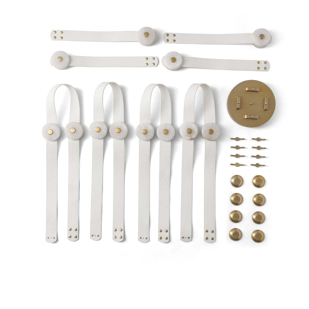 Flat lay of the white leather Clérachic Leather Strap Chandelier kit, alabaster discs, brass canopy and brass fixings.