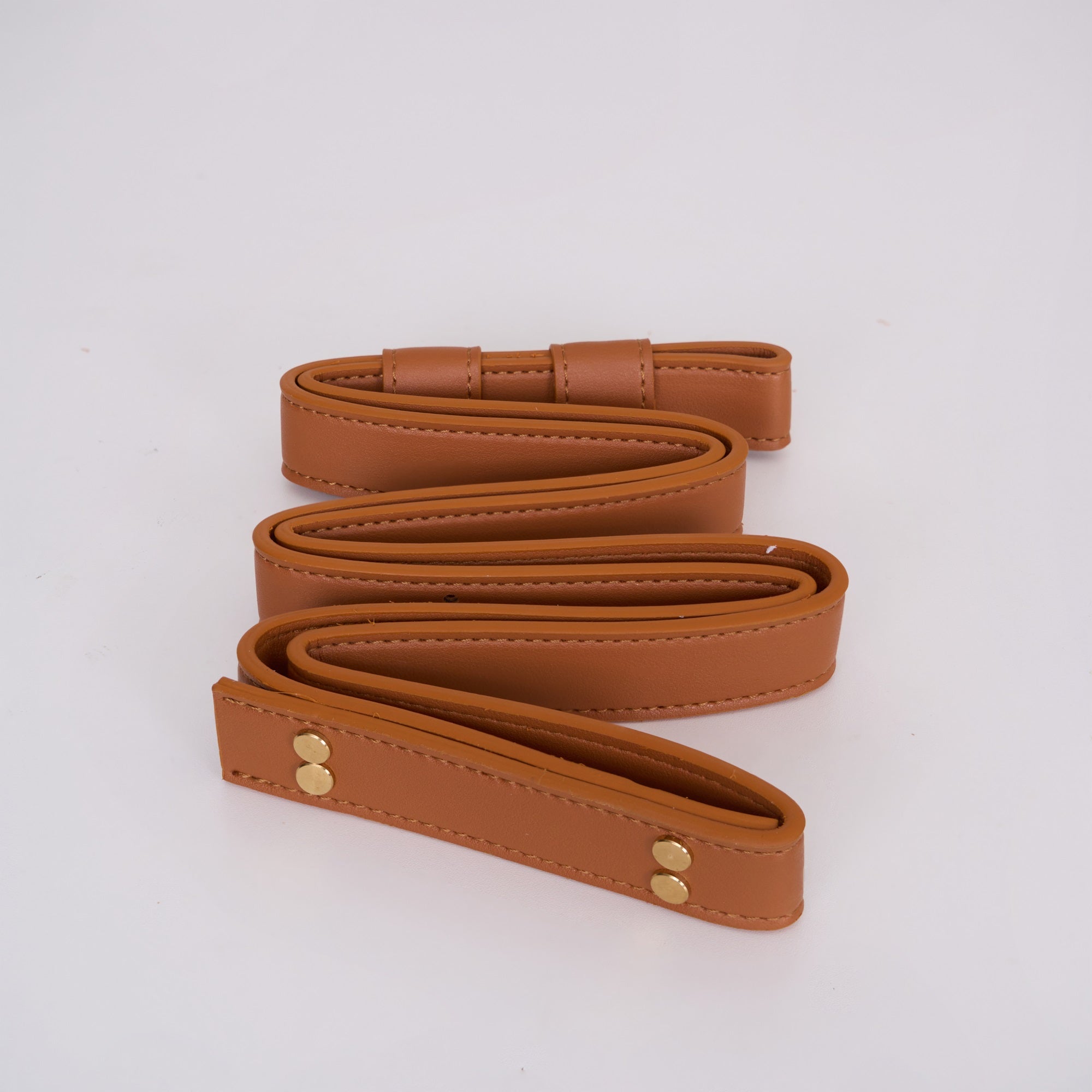 Tan cognac leather belt for the Clérachic ring chandelier, coiled flat with double stitching and two brass rivets at the end.