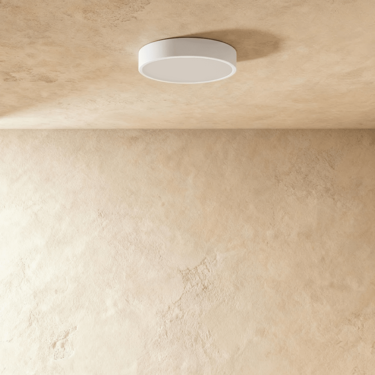 Clérachic round white surface-mounted LED downlight switched off, showing its flat frosted diffuser and slim white rim.
