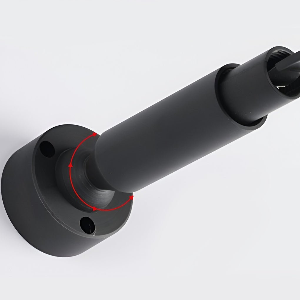 Close view of the black round end bracket and tube that anchor this Clérachic strip light to the wall.